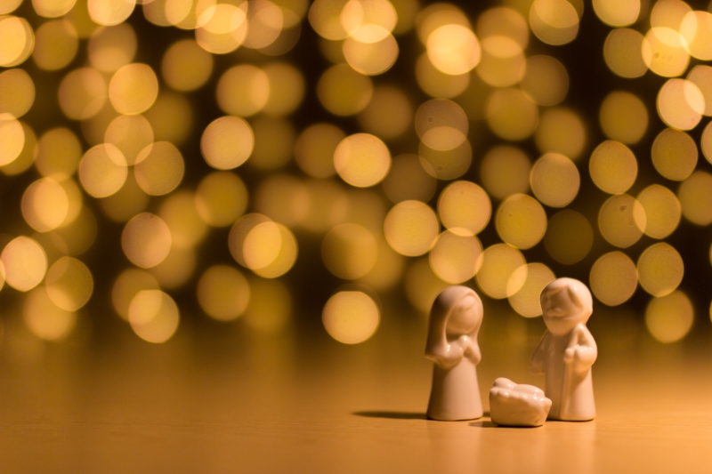 white ceramic figurines of Mary, Joseph and baby Jesus