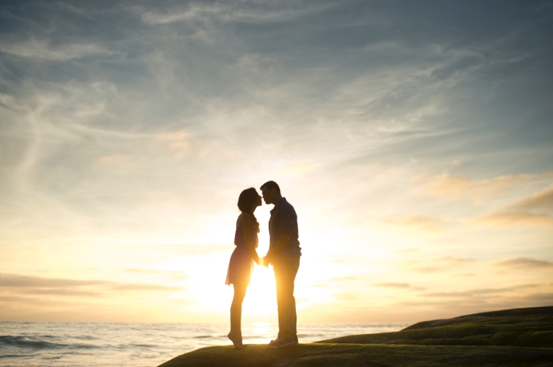 silhouette man and woman beach