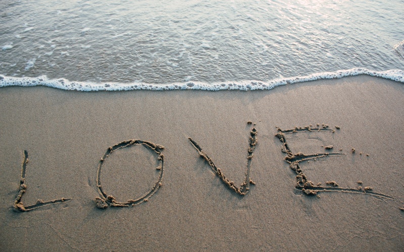 beach, waters edge LOVE written in the sand. Not Qualified Blog