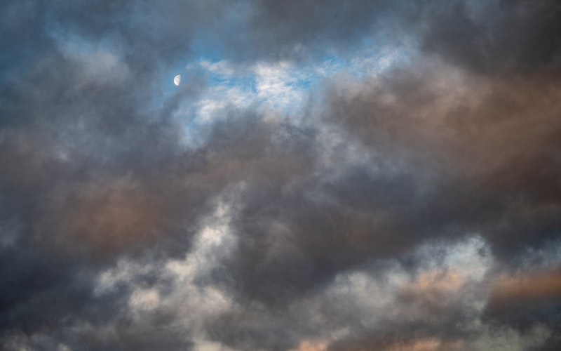 cloudy skies, with a glimpse of beautiful sky above them, blog post Job's God